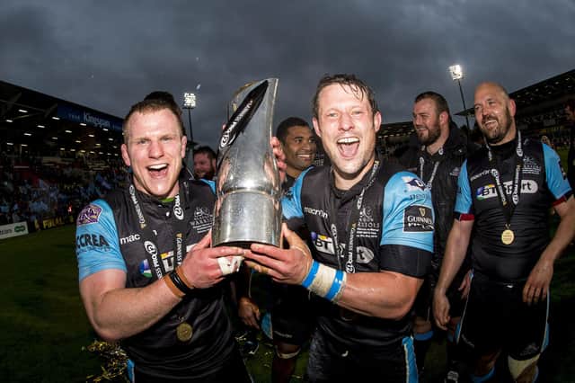 Glasgow Warriors' Pete Horne, right, and Chris Fusaro celebrate with the Pro12 trophy after the win over Munster in the 2015 final in Belfast. (Photo: Gary Hutchison/SNS)