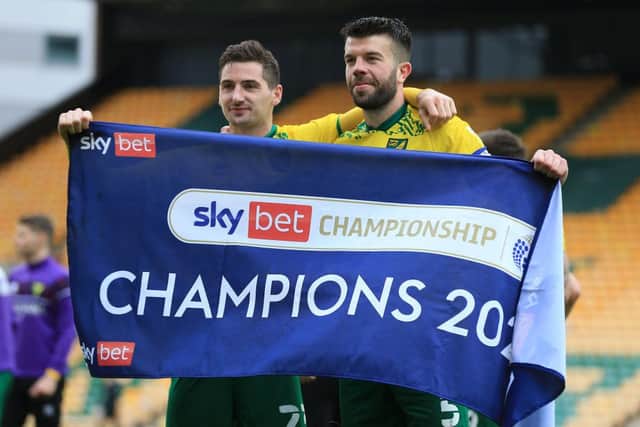 Kenny McLean and Grant Hanley of Norwich City celebrate winning the Sky Bet Championship. (Photo by Stephen Pond/Getty Images)