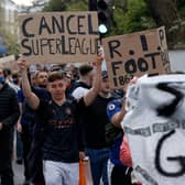 Football supporters demonstrated against the proposed European Super League outside of Stamford Bridge.