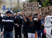 Football supporters demonstrated against the proposed European Super League outside of Stamford Bridge.