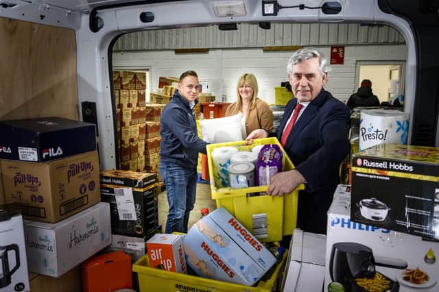 From left: Simon McMahon of Amazon, Pauline Buchan of The Cottage Family Centre, and former PM Gordon Brown. Picture: contributed.