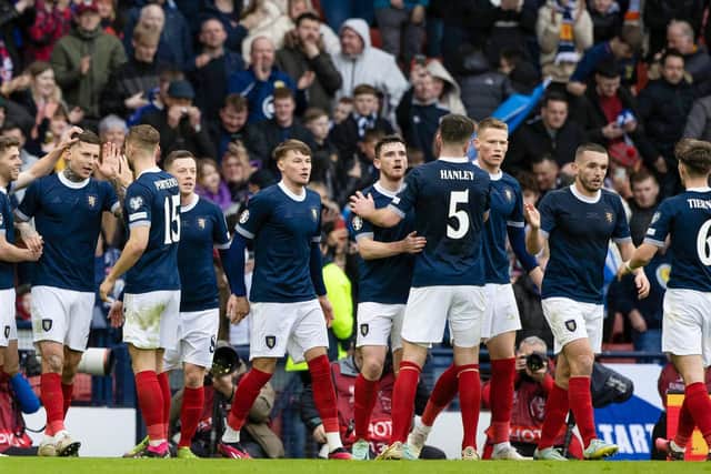 The Scotland players celebrate going 2-0 up against Cyprus at Hampden.