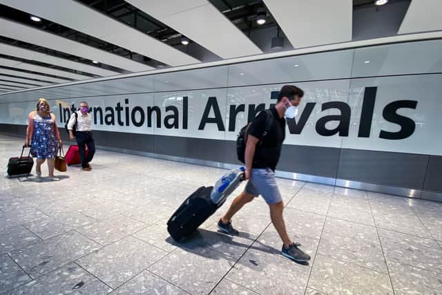 Passengers in the arrivals hall at Heathrow Airport. Picture: Aaron Chown/PA Wire