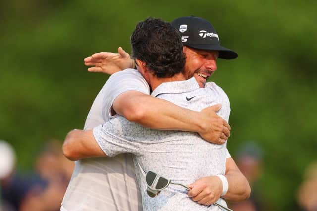 Michael Block and playing partner Rory McIlroy share a huge hug on the 18th green during the final round of the PGA Championship at Oak Hill Country Club in Rochester, New York. Picture: Andrew Redington/Getty Images.