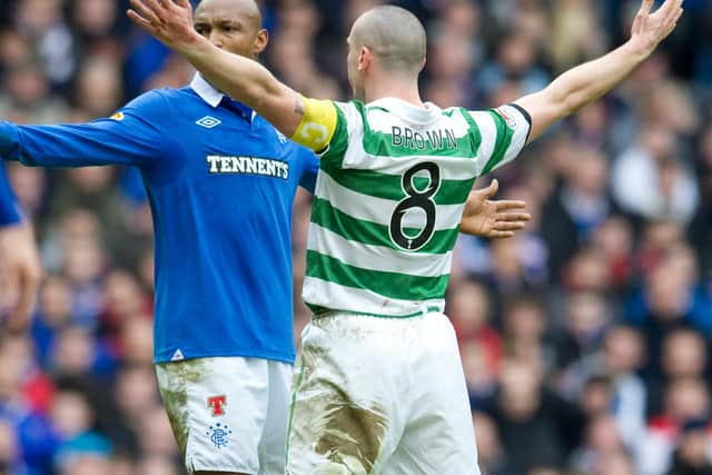 Celtic captain Scott Brown (right) celebrates his strike in front of El Hadji Diouf to give birth to 'the Broony' in his most iconic derby act, after scoring in the 2-2 Scottish Cup draw between the pair in February 2011. (Photo by Craig Williamson/SNS Group).