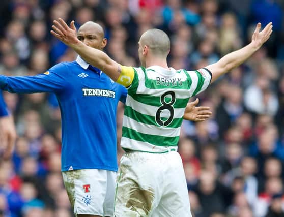 Celtic captain Scott Brown (right) celebrates his strike in front of El Hadji Diouf to give birth to 'the Broony' in his most iconic derby act, after scoring in the 2-2 Scottish Cup draw between the pair in February 2011. (Photo by Craig Williamson/SNS Group).