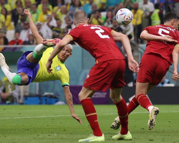 Brazil's Richarlison scores his spectacular bicycle kick in the 2-0 win over Serbia at the Lusail Stadium. (Photo by ADRIAN DENNIS/AFP via Getty Images)