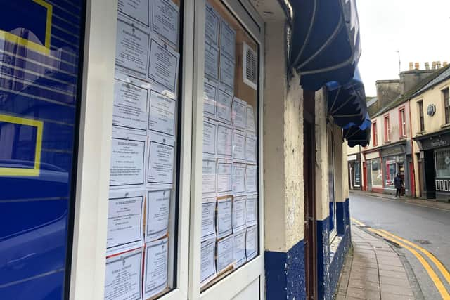 The window of a Stranraer newsagent filled with death notices from just one week.