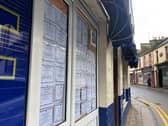 The window of a Stranraer newsagent filled with death notices from just one week.