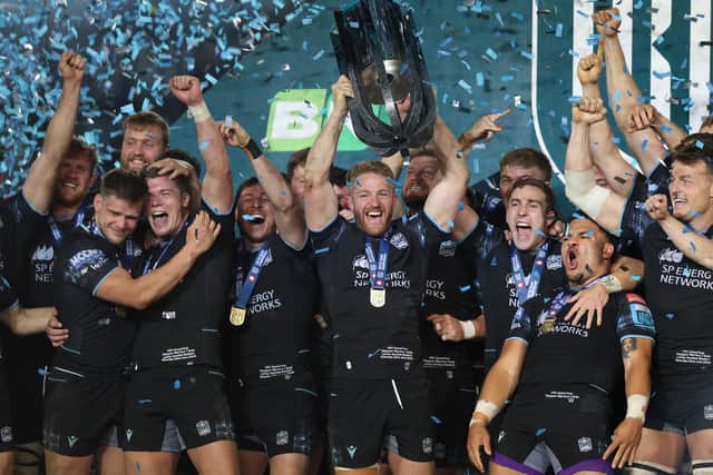 Glasgow Warriors captain Kyle Steyn lifts the trophy after winning the United Rugby Championship (URC) final against The Bulls at Loftus Versfeld Stadium in Pretoria. (Photo by PHILL MAGAKOE/AFP via Getty Images)