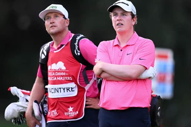 Bob MacIntyre and his caddie Mike Thomson watch a shot from one of the players in their group during the first round of the Estrella Damm N.A. Andalucía Masters at Real Club Valderrama in Cadiz. Picture: Ross Kinnaird/Getty Images.