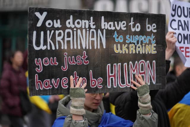 People taking part in a demonstration through Dublin city centre to mark three years since Russia invaded Ukraine. Picture: Brian Lawless/PA Wire