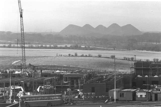 Old and New: Construction of Livingston Police Station with the Five Sisters bings - a legacy of the area's  shale mining industry - in the background. PIC: West Lothian Council.