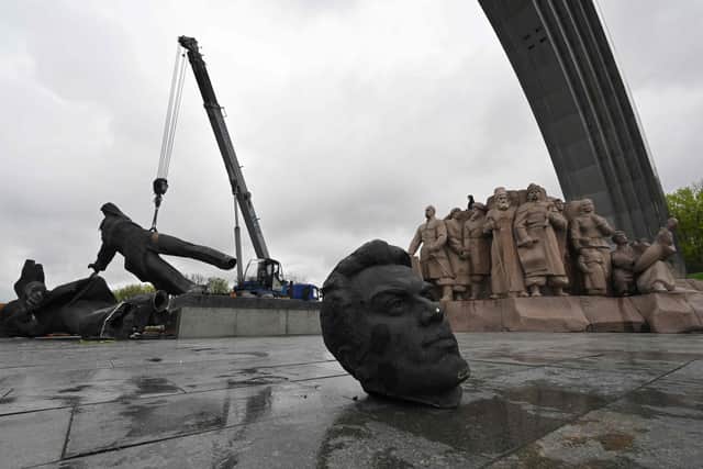 The Soviet monument to Ukraine-Russia friendship being dismantled in Kyiv.
