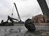 The Soviet monument to Ukraine-Russia friendship being dismantled in Kyiv.
