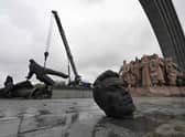 The Soviet monument to Ukraine-Russia friendship being dismantled in Kyiv.