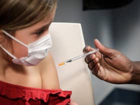 (FILES) This file photo taken on December 17, 2021 shows a child receiving a dose of the Pfizer/BioNTech vaccine against Covid-19, in Paris. - The vaccination of children aged 5 to 11 is officially open, French Health Minister Olivier Veran announced on December 22, 2021, although he said the booster dose had not been extended to teenagers "for the moment". (Photo by GEOFFROY VAN DER HASSELT / AFP) (Photo by GEOFFROY VAN DER HASSELT/AFP via Getty Images)