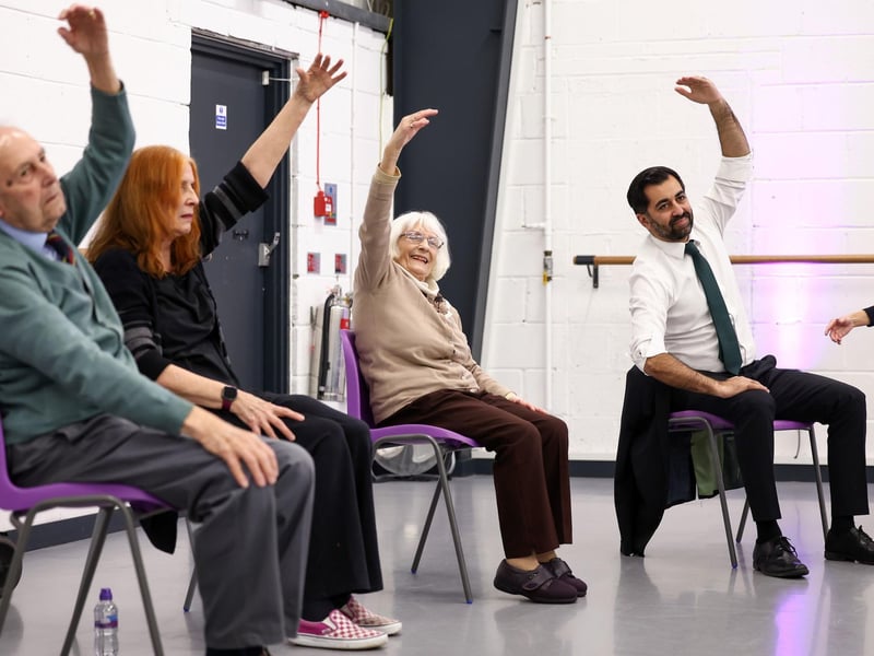 Humza Yousaf takes part in a dance performance during a visit to the Edinburgh Community Performing Arts re-connect project