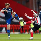 Scotland team-mates Stuart Armstrong and John Fleck challenge for the ball during a Southampton v Sheffield United match.