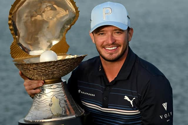 Ewen Ferguson shows off the trophy after winning the Commercial Bank Qatar Masters at Doha Golf Club. Picture: Stuart Franklin/Getty Images.