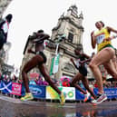 Competitors run past St George's Tron Church during the Women's Marathon at the 2014 Commonwealth Games in Glasgow (Picture: Ryan Pierse/Getty Images)