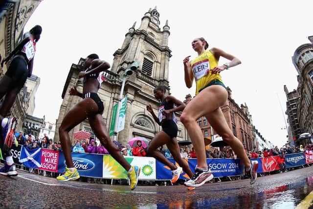 Competitors run past St George's Tron Church during the Women's Marathon at the 2014 Commonwealth Games in Glasgow (Picture: Ryan Pierse/Getty Images)