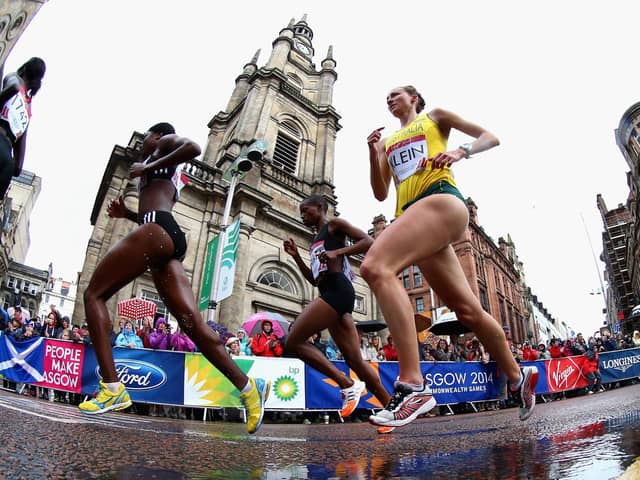 Competitors run past St George's Tron Church during the Women's Marathon at the 2014 Commonwealth Games in Glasgow (Picture: Ryan Pierse/Getty Images)