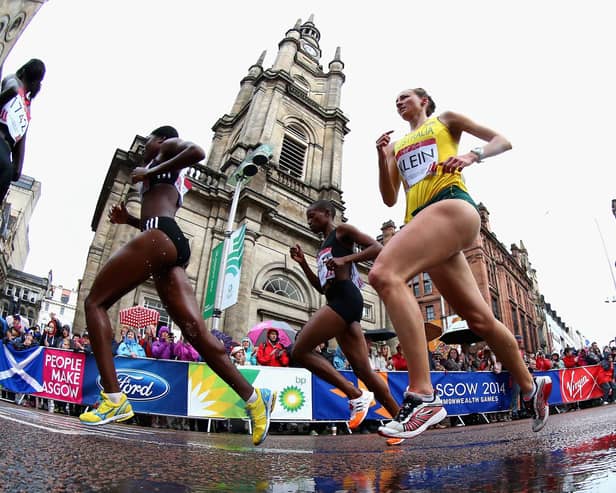Competitors run past St George's Tron Church during the Women's Marathon at the 2014 Commonwealth Games in Glasgow (Picture: Ryan Pierse/Getty Images)