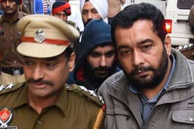 This photo taken on November 24, 2017 shows Jagtar Singh Johal being escorted to a court in Ludhiana in India's northern Punjab state. AFP PHOTO / Shammi MEHRA