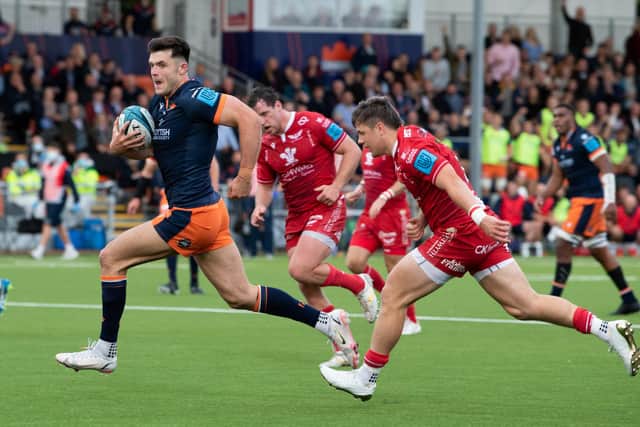 Blair Kinghorn, playing at stand-off, goes through to score against Scarlets at the DAM Health Stadium. Picture: Ross Parker/SNS