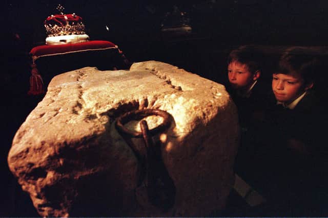 Two children examine the Stone of Destiny in  Edinburgh Castle following its return to Scotland in 1996.