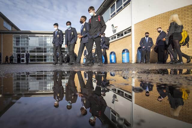 Students arrive at St Andrew's RC Secondary School in Glasgow as more pupils are returning to school in Scotland in the latest phase of lockdown easing. Picture: PA