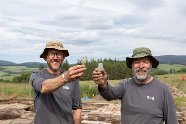 Archaeologists Daniel Rhodes and Derek Alexander from National Trust for Scotland with whisky tasting glasses found at the original 19th Century Glenlivet distillery. PIC: Alison White/NTS.