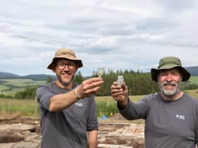 Archaeologists Daniel Rhodes and Derek Alexander from National Trust for Scotland with whisky tasting glasses found at the original 19th Century Glenlivet distillery. PIC: Alison White/NTS.