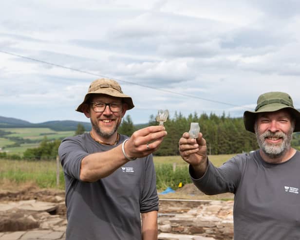 Archaeologists Daniel Rhodes and Derek Alexander from National Trust for Scotland with whisky tasting glasses found at the original 19th Century Glenlivet distillery. PIC: Alison White/NTS.
