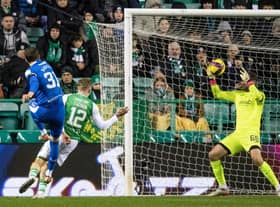 Hibs goalkeeper David Marshall saves from Rangers' Borna Barisic during the Ibrox side's 4-1 win at Easter Road. Photo by Mark Scates / SNS Group