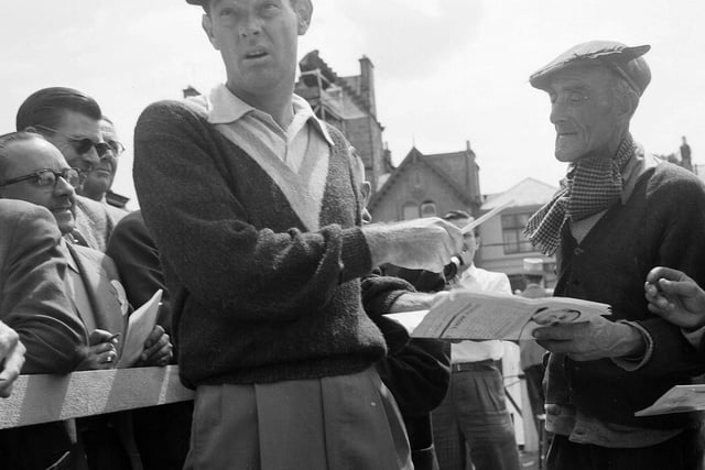 US Golfer Cary Middlecoff signs an autograph at the 1957 Open Championship.