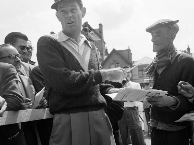 US Golfer Cary Middlecoff signs an autograph at the 1957 Open Championship.