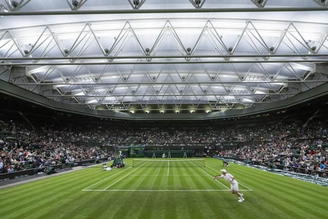 Andy Murray in action against Nikoloz Basilashvili in the Gentlemen's Singles first round on Centre Court on day one of Wimbledon. Picture: Bob Martin/PA Wire