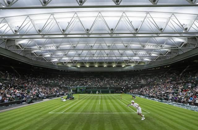 Andy Murray in action against Nikoloz Basilashvili in the Gentlemen's Singles first round on Centre Court on day one of Wimbledon. Picture: Bob Martin/PA Wire