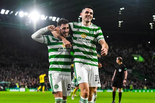 Celtic’s Josip Juranovic celebrates with Tom Rogic after scoring to make it 2-0.