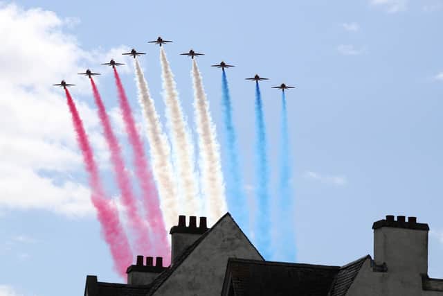 The RAF's Red Arrows soar over Edinburgh city centre. Picture: Scott Heppell/WPA Pool/Getty Images