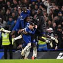 Chelsea players mob hat-trick hero Cole Palmer during the 4-3 win over Man Utd.