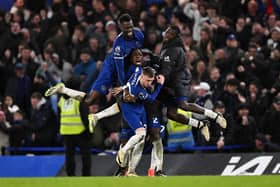 Chelsea players mob hat-trick hero Cole Palmer during the 4-3 win over Man Utd.