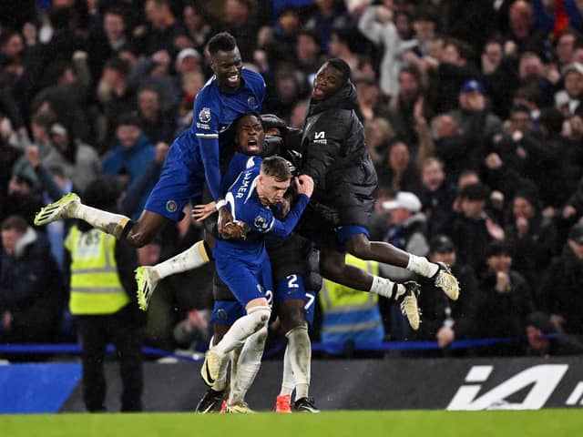 Chelsea players mob hat-trick hero Cole Palmer during the 4-3 win over Man Utd.