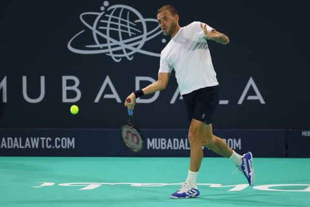 Britain's Dan Evans returns the ball to Andy Murray. (Photo by GIUSEPPE CACACE/AFP via Getty Images)