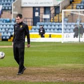 Referee Don Robertson inspects the Dens Park pitch ahead of calling off Dundee v Rangers. (Photo by Alan Harvey / SNS Group)