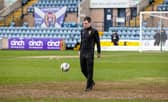 Referee Don Robertson inspects the Dens Park pitch ahead of calling off Dundee v Rangers. (Photo by Alan Harvey / SNS Group)