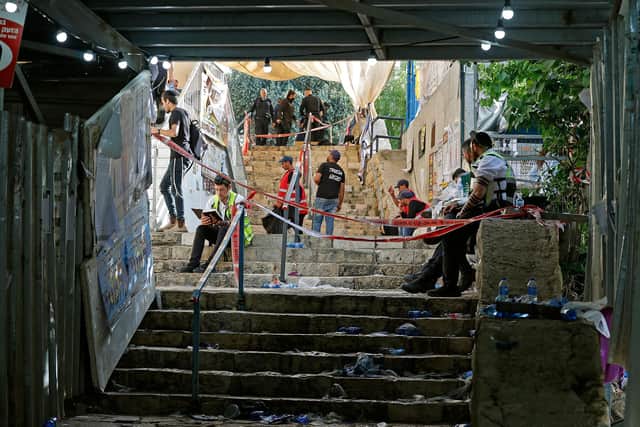 Rescue teams in the aftermath of a stampede at the scene of a religious gathering in Meron in northern Israel near the reputed tomb of Rabbi Shimon Bar Yochai, a second-century Talmudic sage, where mainly ultra-Orthodox Jews flock to mark the Lag BaOmer holiday. Photo by JACK GUEZ/AFP via Getty Images)