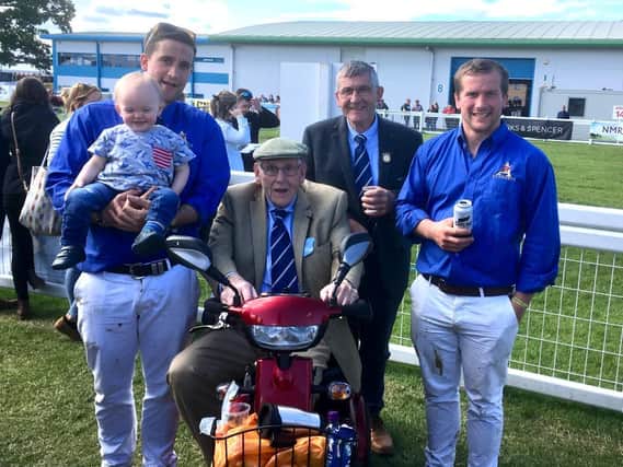 Jim Lawrie with three generations of his family